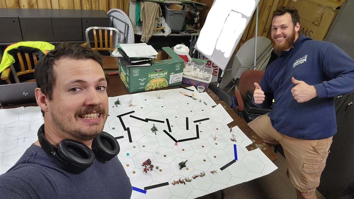 That white paper rolled up. It was super helpful to shrink the sizes of the hexagons. This was exactly the kind of help Jonathon needed, and Nicholas figured it all out!